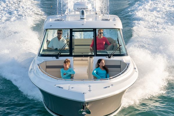 Aerial front view of family in a titanium DC 326.
