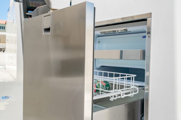 Detail view of DC 326 entertainment center open stainless steel drawer refrigerator